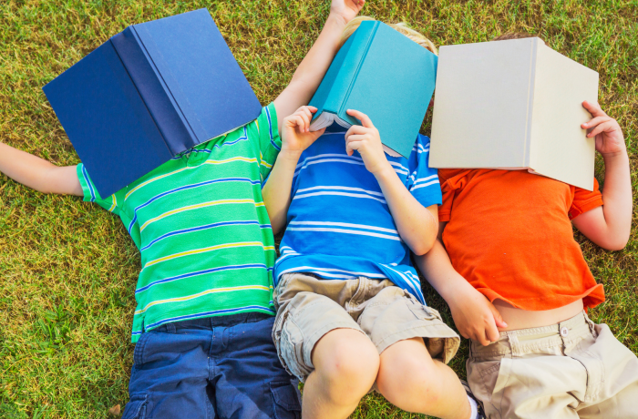 Children with books outside