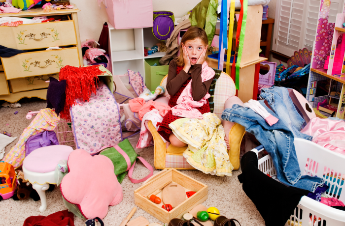 Girl in a messy bedroom