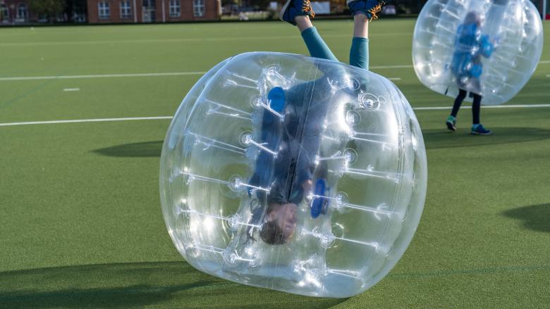 Boy in an upside down zorb