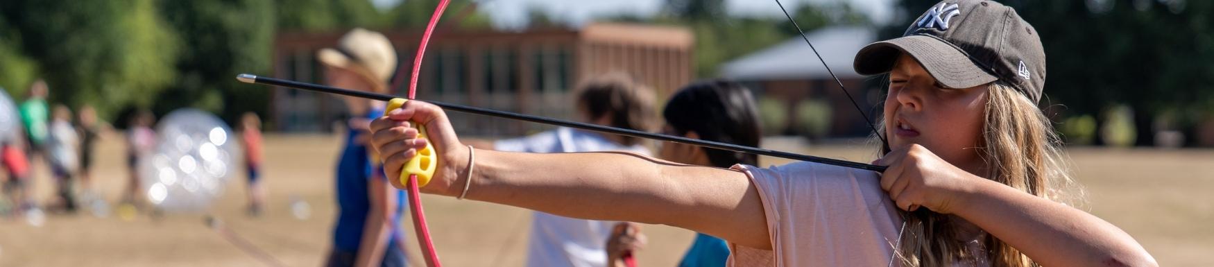 Children with a bow and arrow