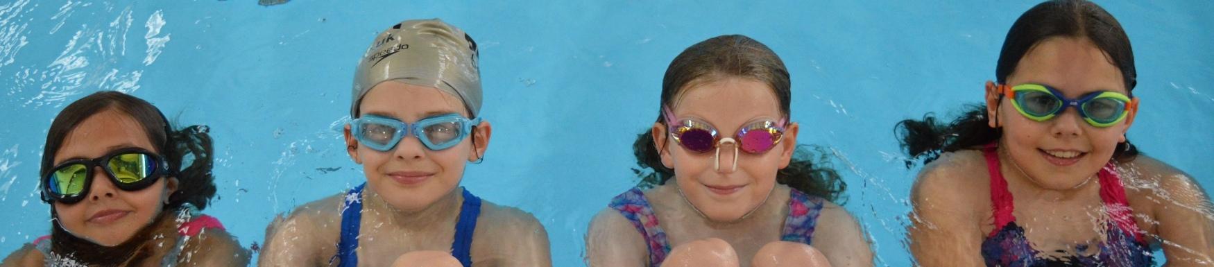 Girls swimming in a swimming pool